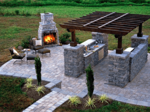 An outdoor living space with a fireplace and pergola