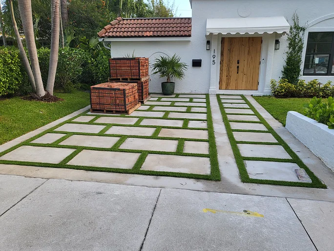 A driveway with concrete pavers installed by paver installation contractors in Palm Beach County, FL
