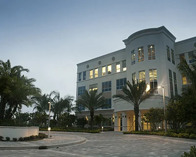 A circular driveway outside a building constructed by professional paver installers in Palm Beach County, FL