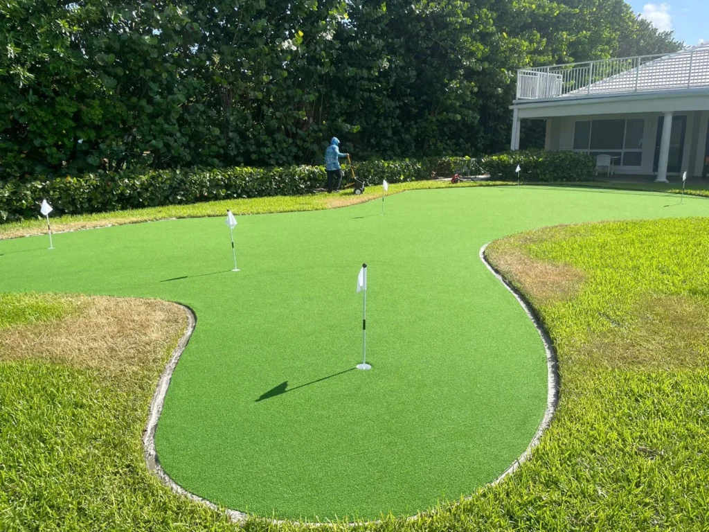 Artificial turf on a putting green installed by Exotic Pavers, artificial turf installers