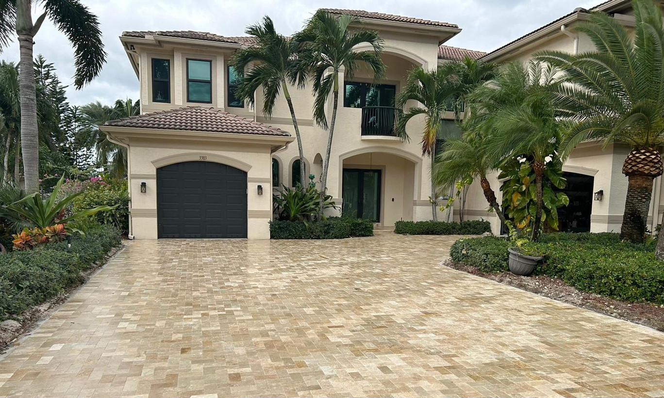 marble driveway pavers in front of a large white house