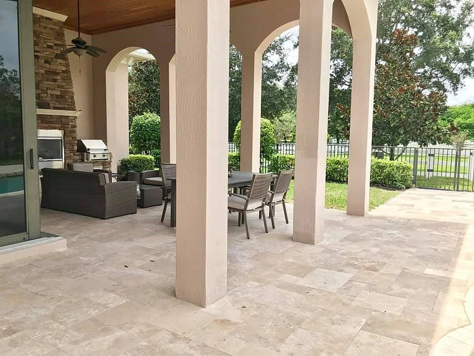 Backyard landscape with porcelain pavers installed in Palm Beach County, FL
