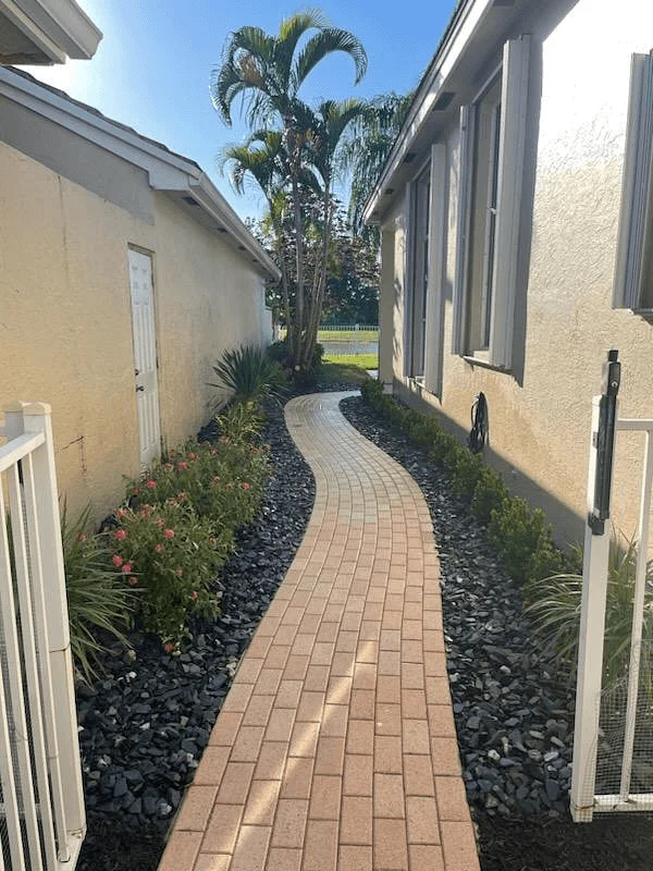 Narrow patio walkway done by paver installers in Palm Beach County, FL