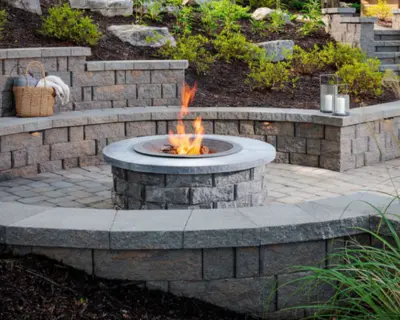 A fire pit surrounded by chairs